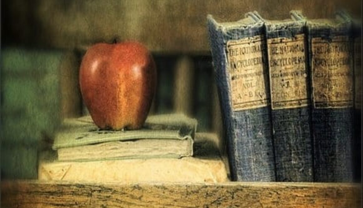 apple-and-books-on-the-teachers-desk-jill-battaglia